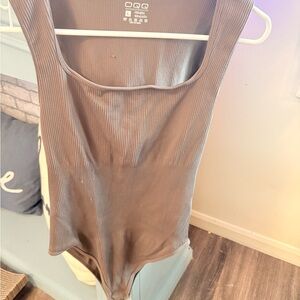 Three OQQ ribbed bodysuit.